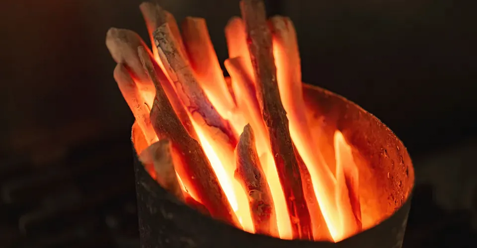 Burning charcoal for the grill at Yakitori Suzune